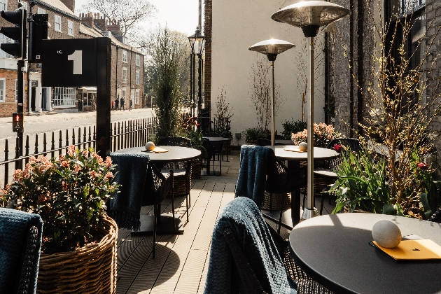 outdoor terraced bar with chairs and heaters