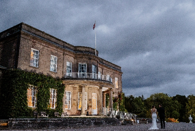 Wood Hall Hotel exterior with bride and groom