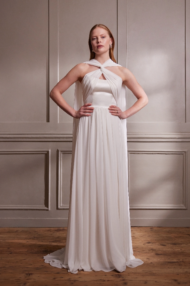 model in Grecian wedding gown with cross necklines 